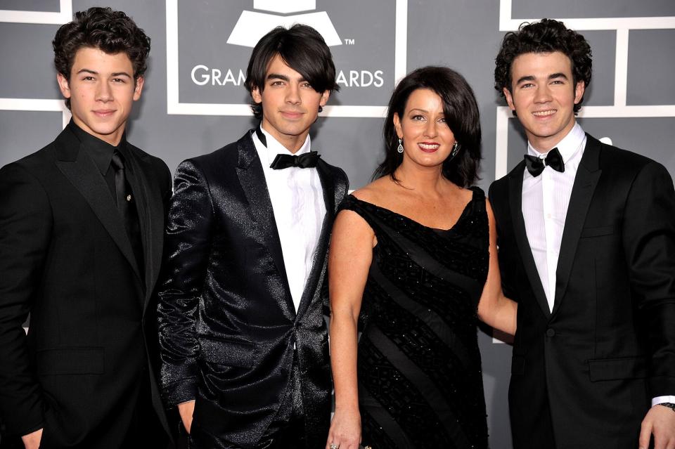 Nick Jonas, Joe Jonas and Kevin Jonas of The Jonas Brothers with mother mother Denise Jonas arrive at the 51st Annual Grammy Awards held at the Staples Center on February 8, 2009 in Los Angeles, California