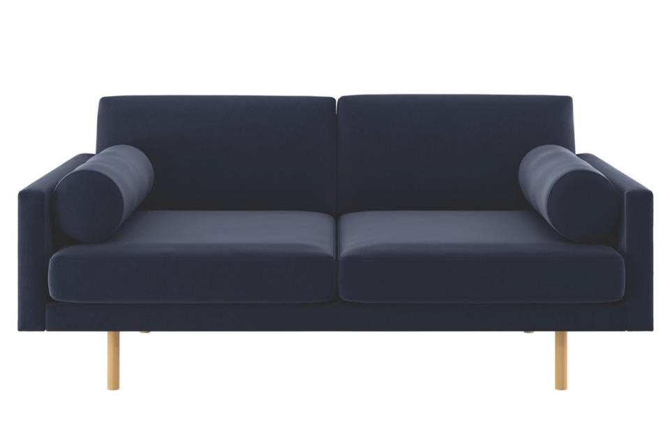 <p>Habitat's squared style is a more contemporary take on the trend.</p><p>Spencer navy velvet two-seater sofa, was £1,900, now £950, <a rel="nofollow noopener" href="http://www.habitat.co.uk/spencer-navy-velvet-2-seater-sofa-oak-legs-384708" target="_blank" data-ylk="slk:Habitat;elm:context_link;itc:0;sec:content-canvas" class="link ">Habitat</a></p>