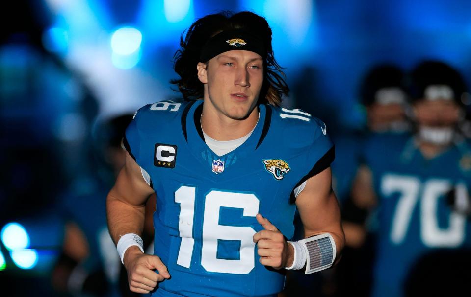 Jacksonville Jaguars quarterback Trevor Lawrence (16) runs onto the field before a regular season NFL football matchup Sunday, Dec. 17, 2023 at EverBank Stadium in Jacksonville, Fla. The Baltimore Ravens defeated the Jacksonville Jaguars 23-7. [Corey Perrine/Florida Times-Union]