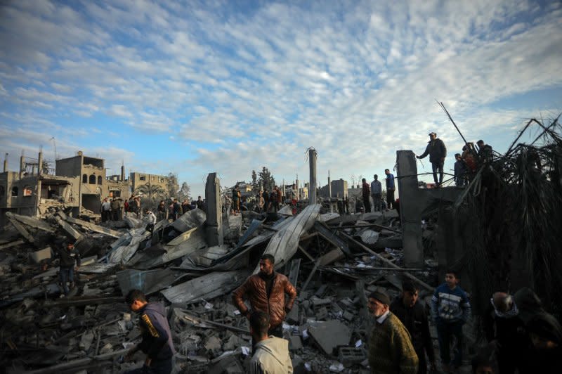 Palestinians search for victims at the site of an Israeli air strike on a mosque in Rafah in the southern region of Gaza on Wednesday. The IDF said it undertook Wednesday's efforts to "eliminate terrorists" throughout Gaza. Photo by Ismael Mohamad/UPI