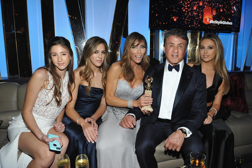 Sylvester Stallone’s posse, including wife Jennifer Flavin and daughters Sophia, Sistine, and Scarlet, kept their big winner close. (Photo: Getty Images)