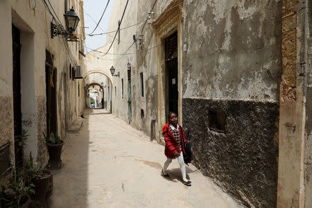 A Libyan girl walks in the old city of Tripoli, Libya April 23, 2019. Picture taken April 23, 2019. REUTERS/Ahmed Jadallah