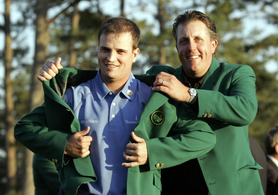 Zach Johnson, left, receives the Masters green jacket from last year’s champion Phil Mickelson after winning the 2007 Masters golf tournament at the Augusta National Golf Club in Augusta, Ga., Sunday, April 8, 2007.