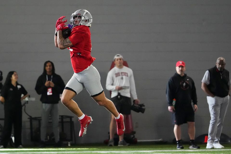 Mar 5, 2024; Columbus, OH, USA; Ohio State Buckeyes wide receiver Brandon Inniss (11) catches a pass during the first spring practice at the Woody Hayes Athletic Center.