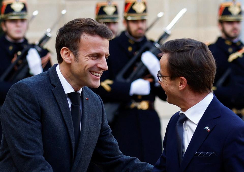 Macron greets Sweden’s Kristersson at the Elysee Palace this morning (Reuters)