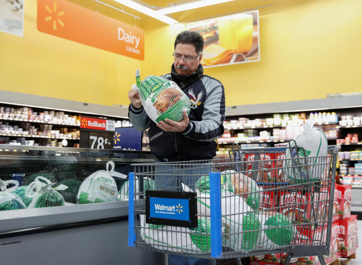 A customer shops for a turkey at a Walmart store in Chicago, Illinois, U.S., November 20, 2018. REUTERS/Kamil Krzaczynski