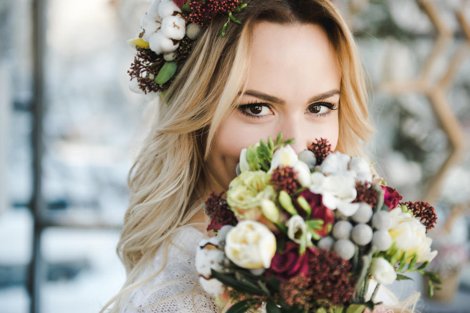 Bride looks at camera as she decides to photoshop sister's tattoo out of photos