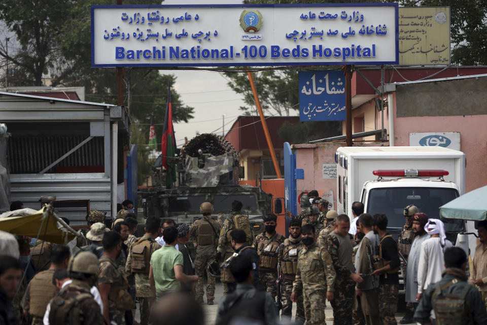 FILE - In this May 12, 2020, file photo, Afghan security officers stand in front of a maternity hospital, in Kabul, Afghanistan. The United Nations on Sunday, June 21, 2020 released a special report expressing concerns over what it called recent “deliberate attacks” against healthcare workers and facilities in Afghanistan during the COVID-19 pandemic. (AP Photo/Rahmat Gul, File)