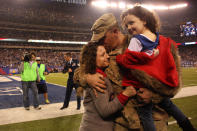 <p>Air Force Tech. Sgt. David H. Brenhuber, of Cherry Hill, N.J. who is serving in Afghanistan, hugs his wife Tammy and daughter Alexis after a surprise reunion during the first half of the New York Giants Vs Green Bay Packers, NFL American Football match at MetLife Stadium, East Rutherford, New Jersey, USA. 17th November 2013. Photo Tim Clayton (Photo by Tim Clayton/Corbis via Getty Images) </p>