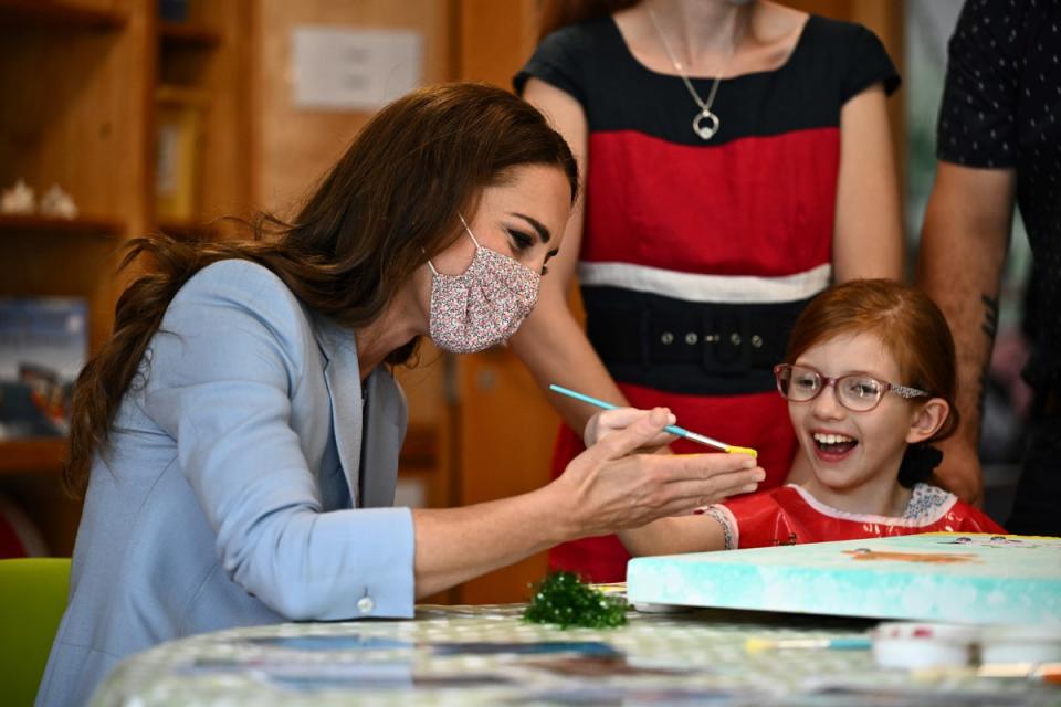 The Duchess of Cambridge puts a hand print on a canvas next to Willow Bamber during a visit to East Anglia’s Children’s Hospices (EACH) in Milton (Ben Stansall/PA) (PA Wire)