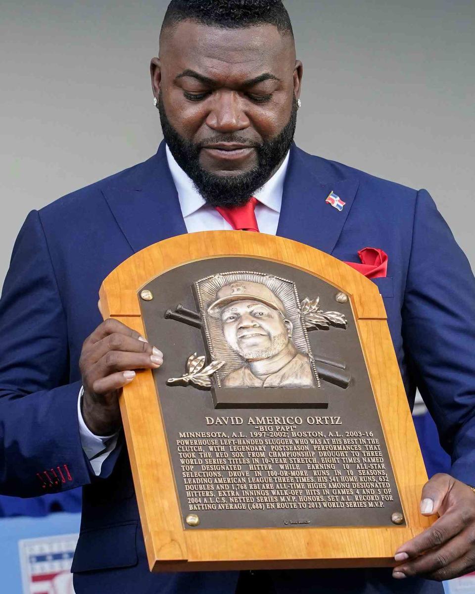 Hall of Fame inductee David Ortiz, formerly of the Boston Red Sox baseball team, holds his plaque during the National Baseball Hall of Fame induction ceremony, at the Clark Sports Center in Cooperstown, N.Y Hall of Fame Inductions Baseball, Cooperstown, United States - 24 Jul 2022