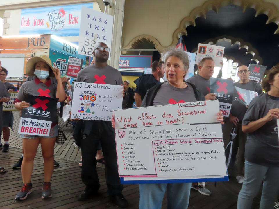 Casino workers and patrons opposed to smoking in the gambling halls demonstrate outside the Hard Rock casino, Thursday, Sept. 22, 2022, in Atlantic City N.J., after New Jersey Gov. Phil Murphy spoke to a major casino industry conference. A bill that would ban smoking in casinos -virtually the only indoor workplace where it is allowed - is stalled in the New Jersey Legislature, even though Murphy has said he will sign it if it passes. (AP Photo/Wayne Parry)