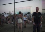 Artist Phillip K. Smith III poses by his light installation called "Reflection Field" at the Coachella Valley Music and Arts Festival in Indio, California April 13, 2014. REUTERS/Mario Anzuoni (UNITED STATES - Tags: ENTERTAINMENT)