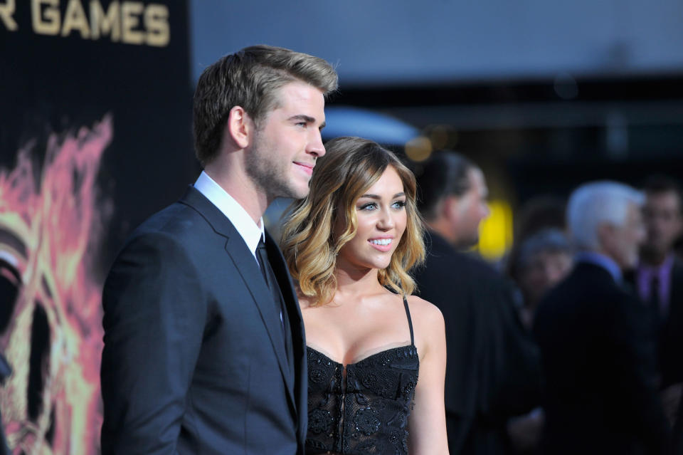 Actors Liam Hemsworth and Miley Cyrus arrive to the premiere of Lionsgate's "The Hunger Games" at Nokia Theatre L.A. Live on March 12, 2012 in Los Angeles, California.&nbsp;