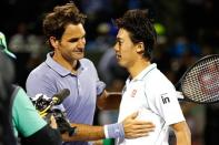 Mar 26, 2014; Miami, FL, USA; Kei Nishikori (R) shakes hands with Roger Federer (L) after their match on day ten of the Sony Open at Crandon Tennis Center. Geoff Burke-USA TODAY Sports