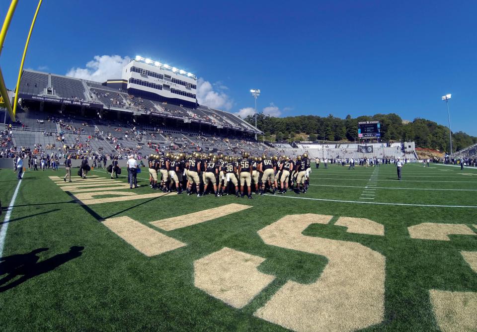 FILE - In this Sept. 19, 2015, file photo, Army players huddle in the end zone  before an NCAA college football game between Army and Wake Forest at Michie Stadium in West Point, N.Y. Army launched a $95 million campaign on Thursda, July 15, 2021, to fund reconstruction of the east stands at Michie Stadium. (AP Photo/Hans Pennink, File)