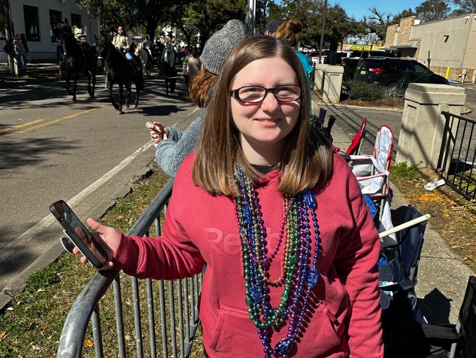matthew wilson wife standing by mardi gras procession in mobile alabama