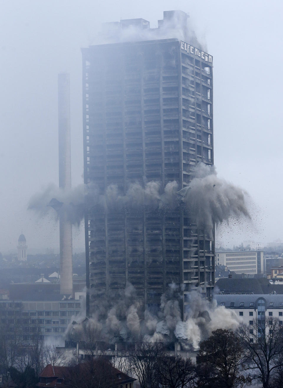 A former university tower is blown up followed by thousands of spectators in Frankfurt, Germany, Sunday, Feb. 2, 2014. (AP Photo/Michael Probst)