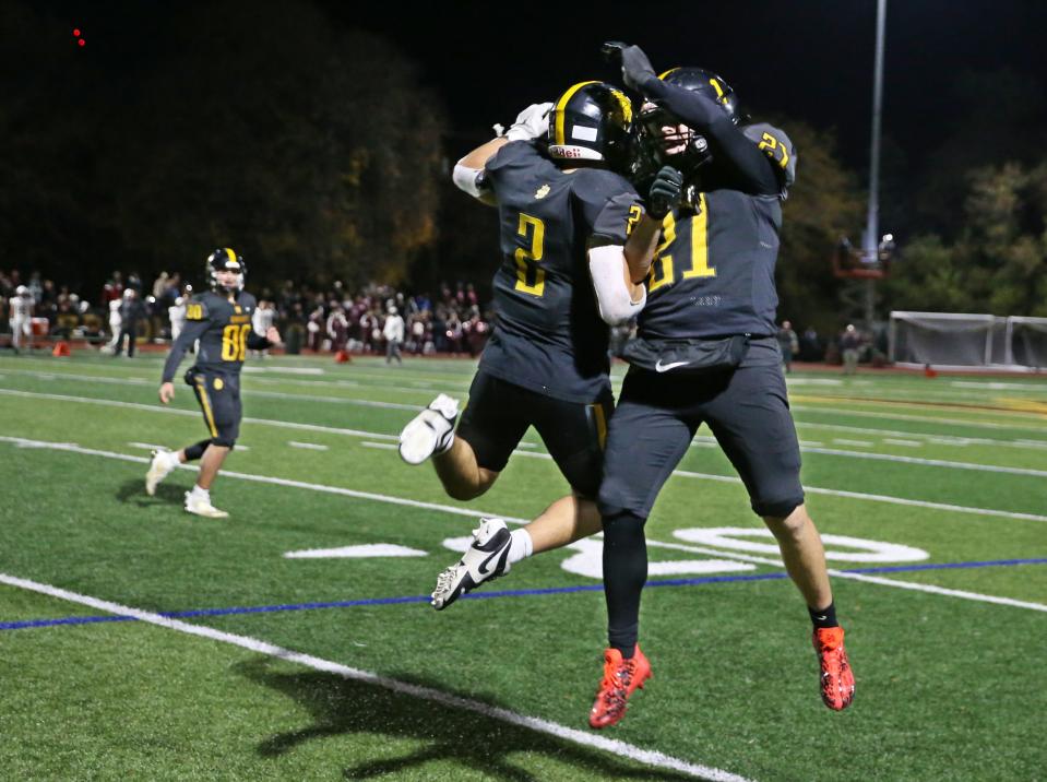 McQuaid's Paul Rizzo celebrates a two point conversion.