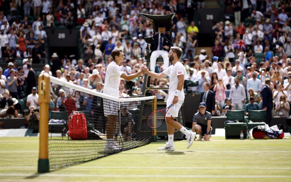 Alex De Minaur (left) and Liam Broady shake hands after their match (Steven Paston/PA) (PA Wire)