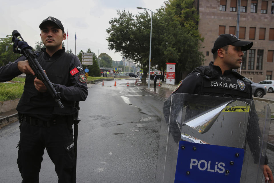 Turkish security forces cordon off an area after an explosion in Ankara, Sunday, Oct. 1, 2023. A suicide bomber detonated an explosive device in the heart of the Turkish capital, Ankara, on Sunday, hours before parliament was scheduled to reopen after a summer recess. A second assailant was killed in a shootout with police. (AP Photo/Ali Unal)