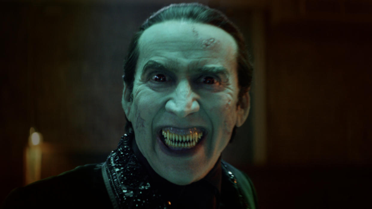  Nicolas Cage flashes an evil grin with his shark-like fangs in Renfield. 