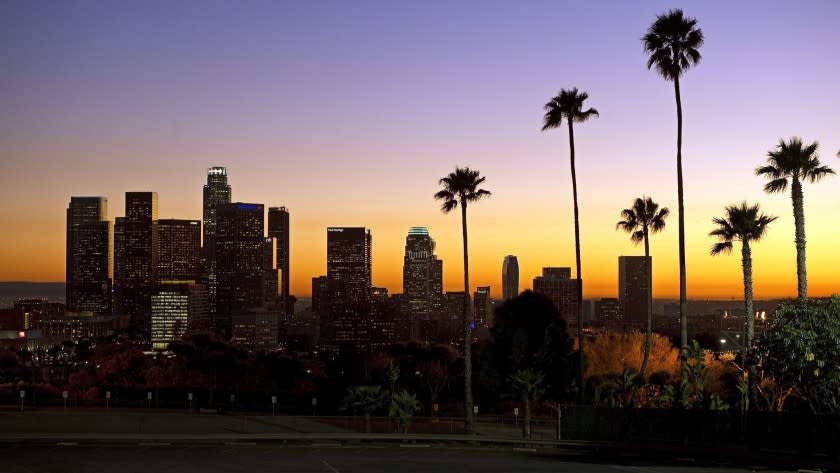 The sun sets beyond downtown Los Angeles in January 2011. Los Angeles is vying to be the sole American bidder for the 2024 Summer Games.