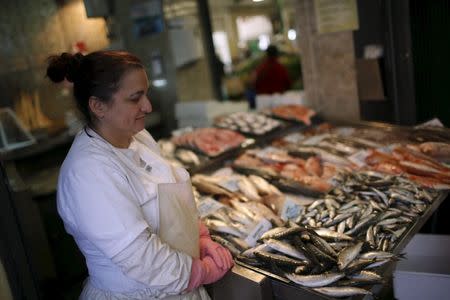 Sonia Silva, 41, waits for customers at her fish stall in Almada's market, near Lisbon, Portugal November 18, 2015. REUTERS/Rafael Marchante