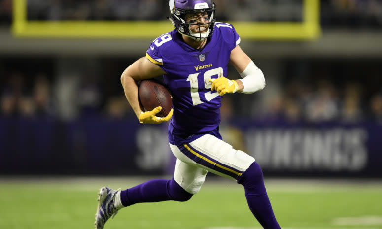 Adam Thielen running with the ball.