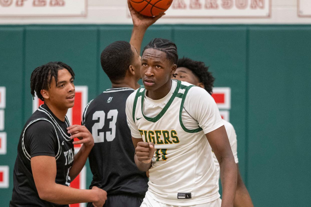 Indianapolis Crispus Attucks High School junior Dezmon Briscoe (11) reacts after being fouled during the first half of an IHSAA Class 4A Boys’ Sectional basketball game against Indianapolis Arsenal Technical High School, Wednesday, Feb. 28, 2024, at Lawrence North High School.