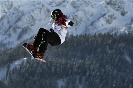 Canada's Sebastien Toutant performs a jump during the men's slopestyle snowboarding qualifying session at the 2014 Sochi Olympic Games in Rosa Khutor February 6, 2014. REUTERS/Dylan Martinez