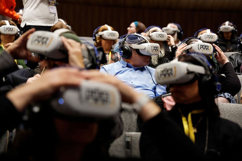 Groups participate in a virtual guided tour of Auschwitz-Birkenau and Polish Jewry before the Holocaust by using Virtual Reality headsets in Jerusalem