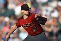 Jul 11, 2018; Denver, CO, USA; Arizona Diamondbacks starting pitcher Shelby Miller (26) delivers a pitch in the first inning against the Colorado Rockies at Coors Field. Mandatory Credit: Ron Chenoy-USA TODAY Sports