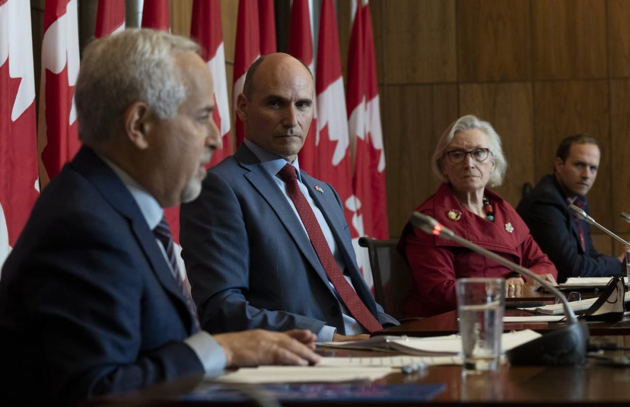 Federal Health Minister Jean-Yves Duclos, Mental Health and Addictions Minister and Associate Minister of Health Carolyn Bennett and MP Nathaniel Erskine-Smith (right) listen as Morris Rosenberg, chair of the independent review board on the impact of legalization of cannabis, speaks at a news conference in Ottawa on Sept. 22. THE CANADIAN PRESS/Adrian Wyld