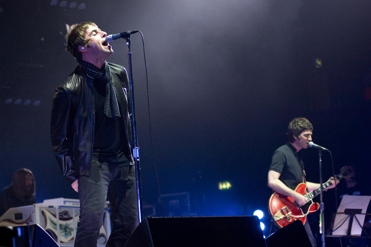 Liam Gallagher and Noel Gallagher of English rock band Oasis playing at Wembley in 2008