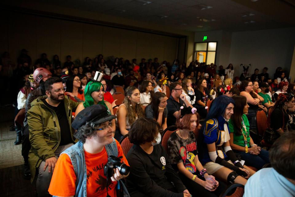 The crowd watches contestants explains heir costumes during a costume contest at the Las Cruces Comic Con on Saturday, Aug. 20, 2022, at Las Cruces Convention Center. 