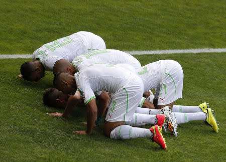 No. 9 - THE PRAYERS. Algeria ended their 28-year-old wait for a World Cup goal when Sofiane Feghouli converted a spot-kick in the 25th minute to give them a 1-0 lead over Belgium. The players, representing the only Arab nation at the World Cup, wore their Muslim faith proudly by kneeling in prayer to give thanks for the goal. REUTERS/Leonhard Foeger