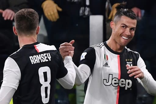 Juventus forward Cristiano Ronaldo (R) has scored in seven consecutive league games