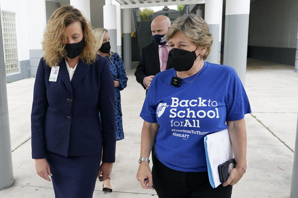 American Federation of Teachers President Randi Weingarten, right, speaks with Broward County Schools interim superintendent Vickie Cartwright, left, while visiting the New River Middle School, Thursday, Sept. 2, 2021, in Fort Lauderdale, Fla. Weingarten is on a nationwide tour of schools to stress the importance of safely returning to five-day-a-week in person learning. Broward County is one of numerous school districts in Florida with a mask mandate for students. (AP Photo/Lynne Sladky)