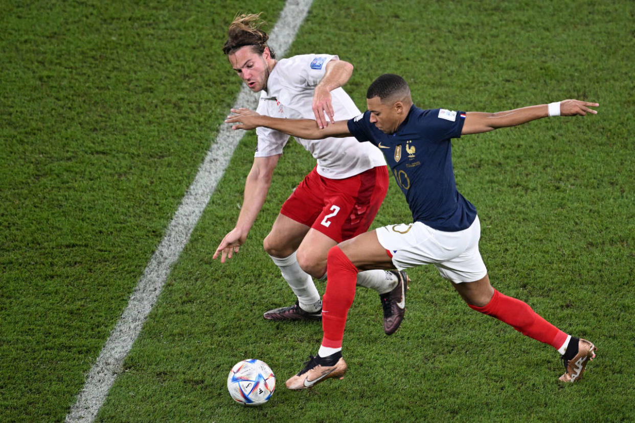 Denmark's defender #02 Joachim Andersen fights for the ball with France's forward #10 Kylian Mbappe during the Qatar 2022 World Cup Group D football match between France and Denmark at Stadium 974 in Doha on November 26, 2022. (Photo by Anne-Christine POUJOULAT / AFP)