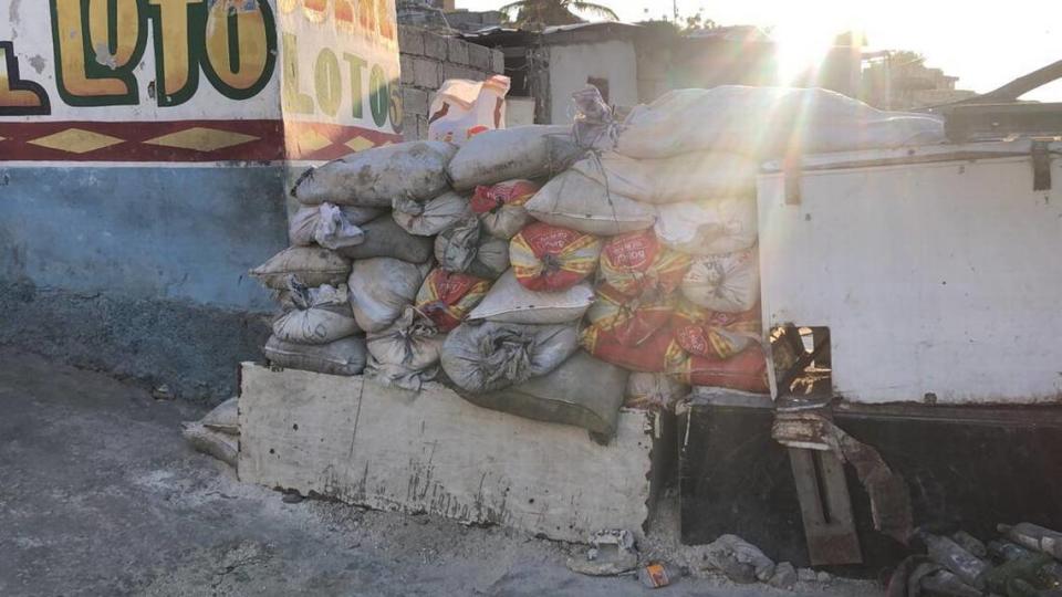 After an angry crowd in a Port-au-Prince neighborhood killed 13 suspected gang members on Monday, April 24, residents in the capital began erecting barricades from whatever they can find to protect themselves from encroaching, menacing gangs. 