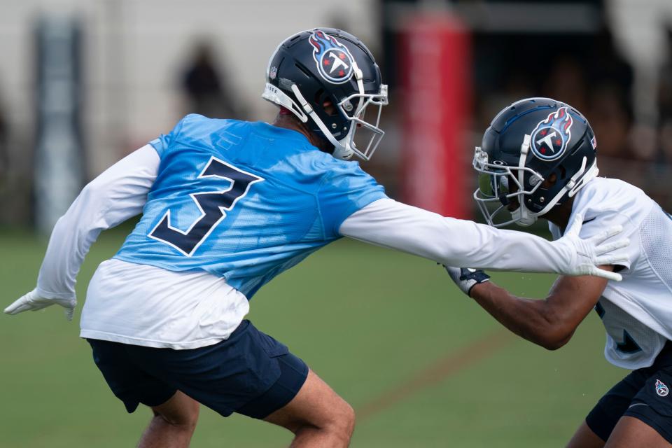 Tennessee Titans cornerback Caleb Farley (3) works with wide receiver Robert Woods (2) during a training camp practice at Ascension Saint Thomas Sports Park Saturday, July 30, 2022, in Nashville, Tenn. 