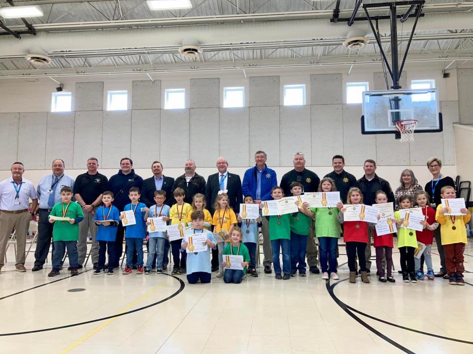 Students were named 'Hodges' Heroes' and received certificates and medals from community leaders.