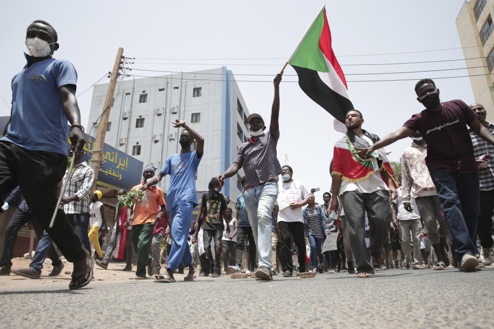 Sudanese anti-military protesters march in demonstrations in the capital of Sudan, Khartoum on June 30, 2022. A Sudanese medical group says multiple people were killed on Thursday in the anti-coup rallies during which security forces fired on protesters denouncing the country’s military rulers and demanding an immediate transfer of power to civilians. (AP Photo/Marwan Ali)