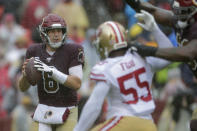 Washington Redskins quarterback Case Keenum (8) looks for a receiver as he is pressured by San Francisco 49ers defensive end Dee Fordin in the first half of an NFL football game, Sunday, Oct. 20, 2019, in Landover, Md. (AP Photo/Julio Cortez)