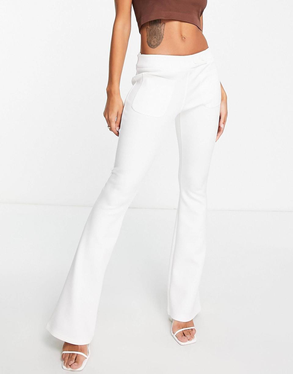 <p><strong>River Island</strong></p><p>us.asos.com</p><p><strong>$68.00</strong></p><p><a href="https://go.redirectingat.com?id=74968X1596630&url=https%3A%2F%2Fwww.asos.com%2Fus%2Friver-island%2Friver-island-scuba-flare-pants-in-white%2Fprd%2F203557412&sref=https%3A%2F%2Fwww.cosmopolitan.com%2Fstyle-beauty%2Ffashion%2Fg42259767%2Fwinter-white-pants%2F" rel="nofollow noopener" target="_blank" data-ylk="slk:Shop Now;elm:context_link;itc:0;sec:content-canvas" class="link ">Shop Now</a></p><p>Your crop top is calling! Put on this high-rise flared pair to instantly add extra attitude to your look. </p>