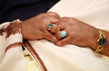 Founder of Pakistan's MQM party, Altaf Hussain, clasps his hands during an interview at the party's offices in London, Britain October 30, 2016. REUTERS/Peter Nicholls