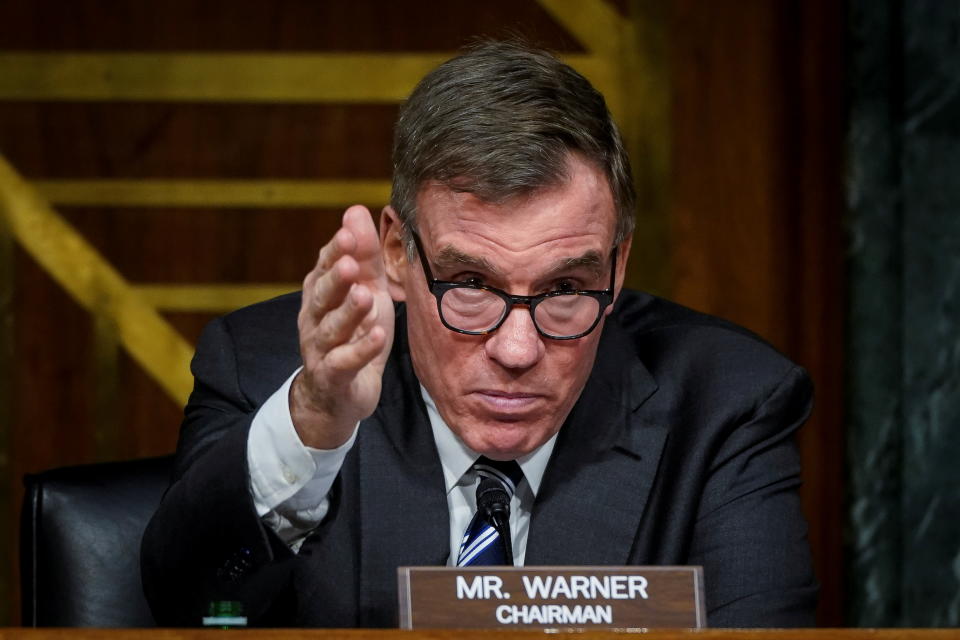 Sen. Mark Warner, with a nameplate saying Mr. Warner, Chairman, questions witnesses.