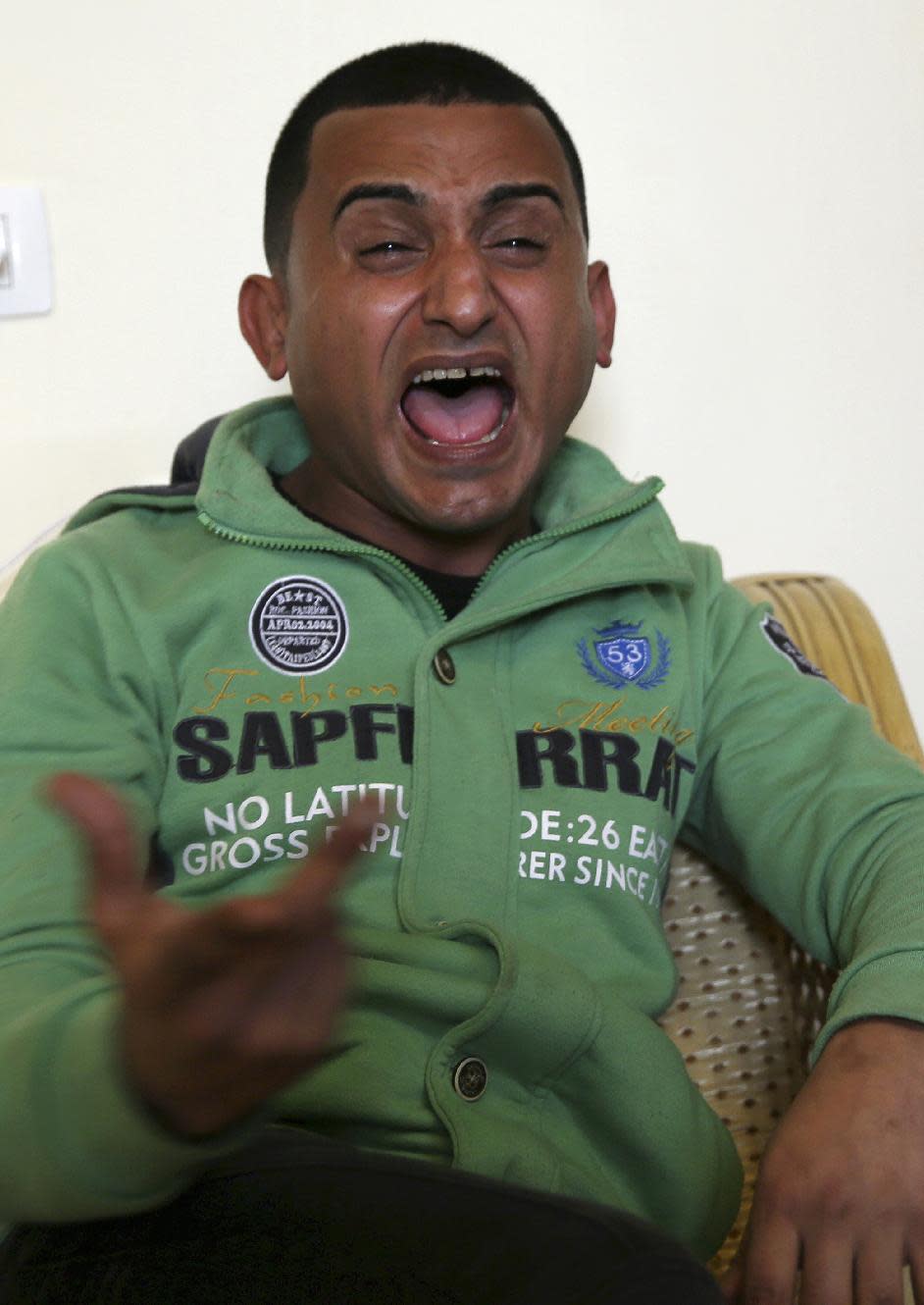 Gaza comedian Adel al-Mashwakhi gestures while singing during an interview with The Associated Press office in Gaza City, Thursday, Jan. 26, 2017. Gaza’s Hamas rulers have released al-Mashwakhi who was arrested two weeks ago for posting a Facebook video lamenting hardships under its rule. Adel al-Mashwakhi says he was released on bail on Wednesday on the condition that he does not make any more “politically flavored” works or discuss the conditions in which he was held. (AP Photo/Adel Hana)