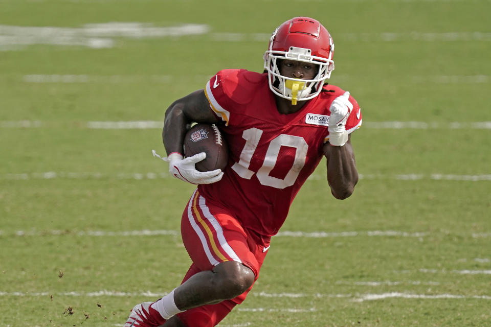 Kansas City Chiefs running back Isiah Pacheco runs the ball during NFL football training camp Sunday, Aug. 7, 2022, in St. Joseph, Mo. (AP Photo/Charlie Riedel)